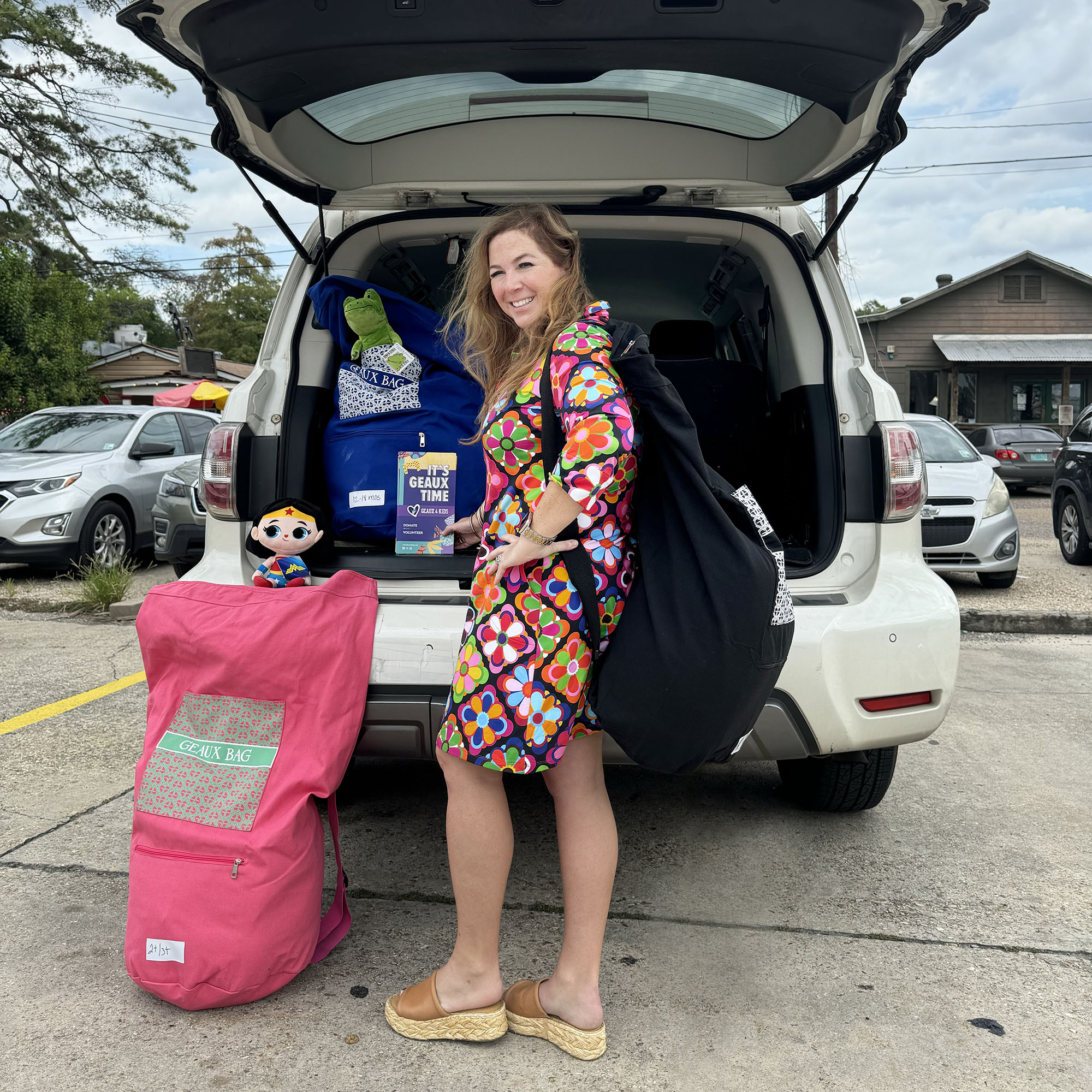 Kaye-Celeste “KC” Kilpatrick delivers Geaux Bags from the back of her car