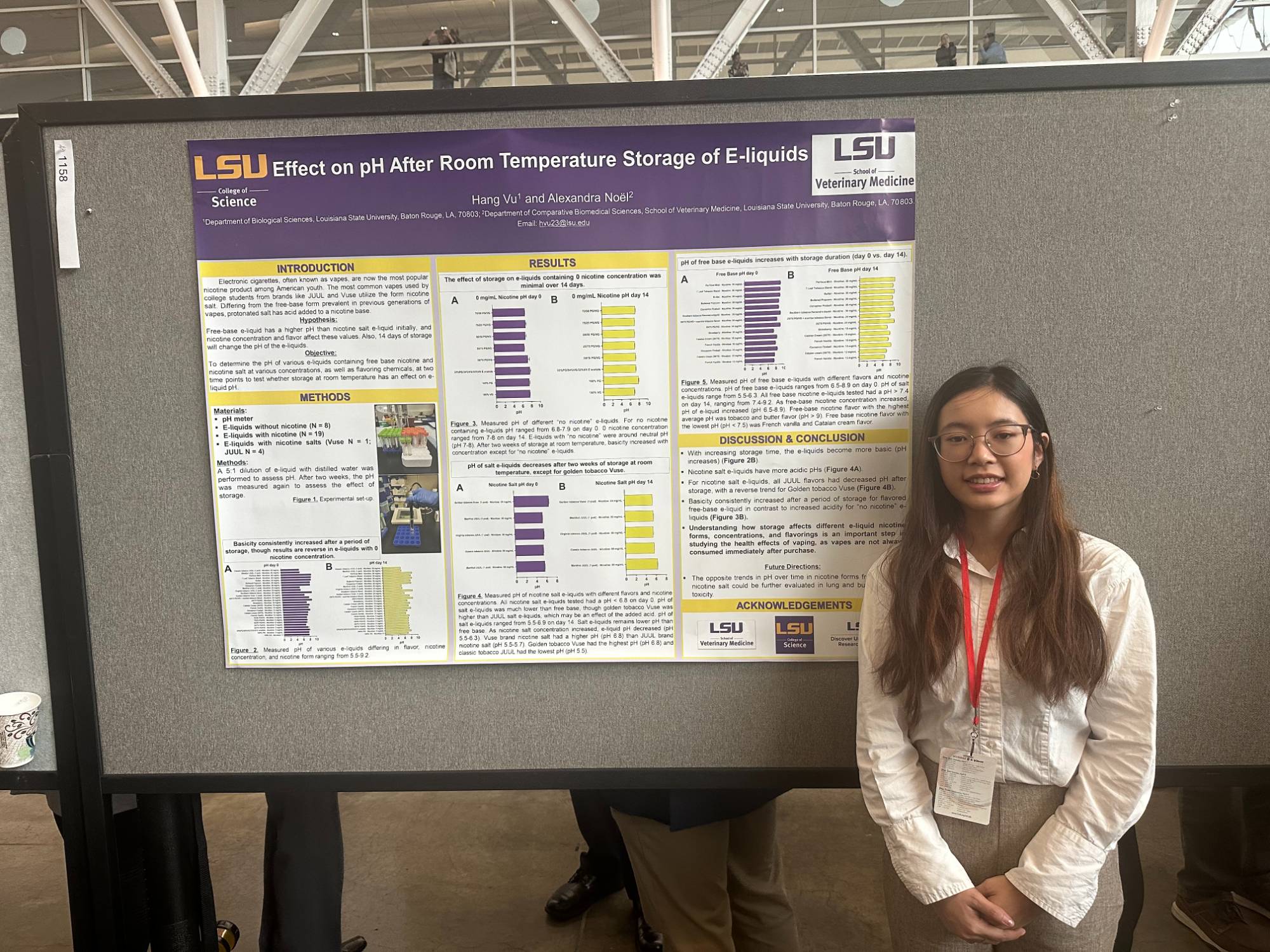 Hang Vu stands with her poster board