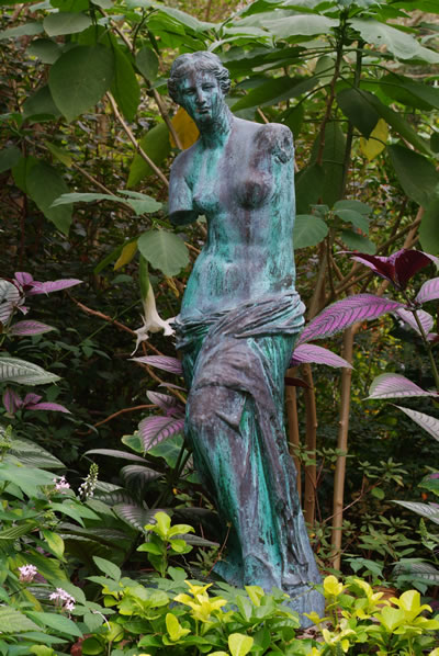 rusted statue of a woman