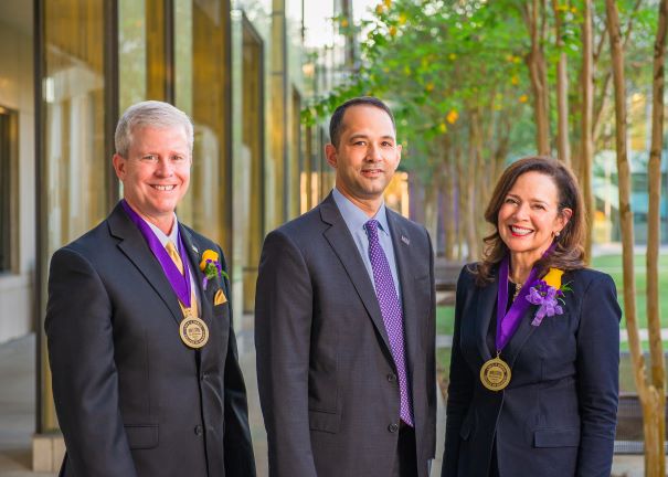 HOD winner with medal pose for photo with the dean