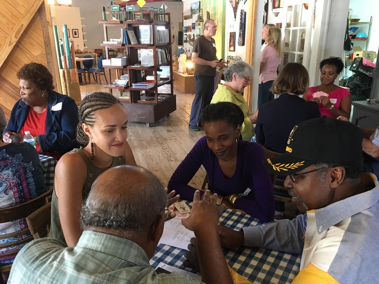 Exchange participants playing a cajun card game