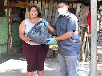 Photo of a young woman with an Operacion Frijol volunteer
