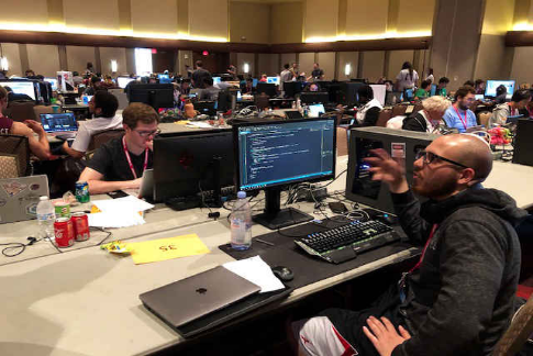 Students writing code on computers
