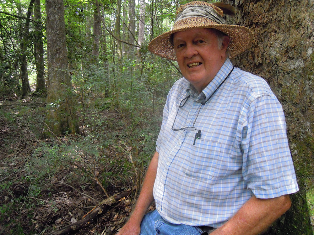 Dr. Charles Allen in forest