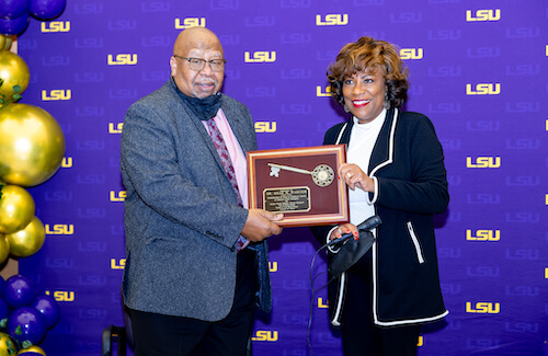 Dr. Isiah M. Warner being presented a key to the city by Baton Rouge Mayor Sharon Weston Broome