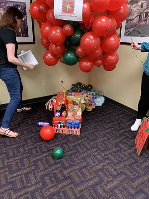 University Registrar Balloon Present filled with Food Items to Donate