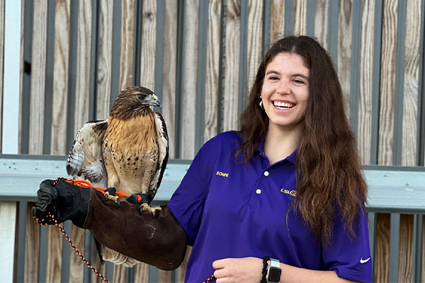 Sonni Tarver with red-tailed hawk