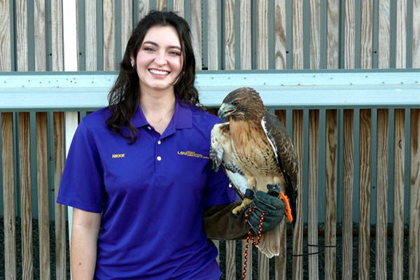 Nikki Torres with red-tailed hawk